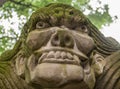 Closeup of aggressive face on statue at religious Ghost City, Fengdu, China