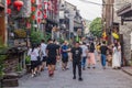 FENGHUANG, CHINA - AUGUST 13, 2018: Crowded cobbled street in Fenghuang Ancient Town, Hunan province, Chi Royalty Free Stock Photo