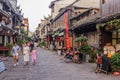 FENGHUANG, CHINA - AUGUST 13, 2018: Crowded cobbled street in Fenghuang Ancient Town, Hunan province, Chi Royalty Free Stock Photo