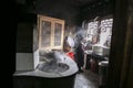 FengHuang, China Feb 21, 2014 an asian woman is cooking a traditional asian kitchen with lot of smoke