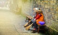 Fenghuang, China - May 15, 2017: Woman rest on street in the Phoenix Fenghuang City