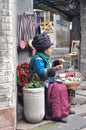 Fenghuang County, China - March 17, 2018. Tujia old woman made craft Fenghuang old city Phoenix Ancient Town,Hunan Province,