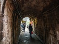 Tourist walking in tunnel of Fenghuang ancient town.