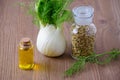 Fennel bulb and seeds, oil, selective focus on dark wooden Royalty Free Stock Photo