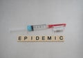 Fentanyl Syringe and Epidemic Spelled with Tiles in a Row Royalty Free Stock Photo