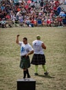 Fergus, Ontario, Canada - 08 11 2018: Traditional Scottish heavies competitions athletes wearing kilts on the Caber Toss