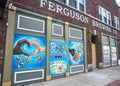 Ferguson, Missouri, USA, June 20, 2020 - black and white hands making the love heart sign painted on Ferguson business boarded up