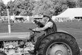 Ferguson Tractor Being Driven by a Man With a Dog on His Lap. Royalty Free Stock Photo