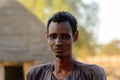 Unidentified Fulani skinny man stands in the village. Fulanis (