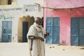 FERLO DESERT, SENEGAL, JANUARY 17, 2020: Unidentified Fulani man walks along the street. Fulanis are the largest tribe in West
