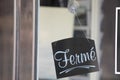 ferme in french means closed text entrance board windows door vintage shop sign close store