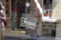 Ferme vintage black panel door windows shop sign fermÃÂ© in french text means closed board store