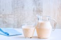 Fermented baked milk in a jug and in a glass.