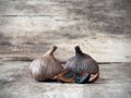 Fermented black garlic bulbs and cloves Royalty Free Stock Photo