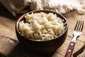 Fermented cabbage in a bowl on wooden cutting board