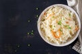 Fermented cabbage. Vegan food. Sauerkraut with carrot and spices in bowl