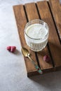 Fermented drink kefir in a glass jar on a light background. Probiotic cold fermented dairy drink Royalty Free Stock Photo