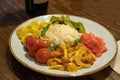 Fermented food on a white plate. Pickled tomatoes, cucumbers, sauerkraut, pickled champignon mushrooms close-up and copy space