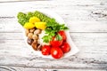 Fermented food on a white plate. Pickled tomatoes, cucumbers, sauerkraut, pickled champignon mushrooms closeup and copy space Royalty Free Stock Photo