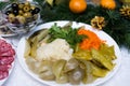 Fermented food on a white plate. Pickled tomatoes, cucumbers, sauerkraut, olives Royalty Free Stock Photo