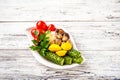 Fermented products in a restaurant close-up. Pickled cucumbers, tomatoes, zucchini, mushrooms on a white plate and copy space Royalty Free Stock Photo