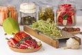 Fermented red hot peppers to enhance immunity with spices and radish grated on a hand grater on a light wooden table Royalty Free Stock Photo