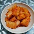 Fermented red kimchi radish with sesame seed