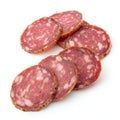 Fermented semihard dried sausage slices isolated on white background Royalty Free Stock Photo