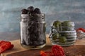 Fermented vegetarian canned food concept. Pickled black olives in a glass jar. The concept of canned food Royalty Free Stock Photo