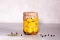 Fermented yellow squash vegetable in a glass jar. The concept of canned food. Garlic in the foreground Royalty Free Stock Photo