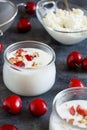 Fermented yogurt kefir in small bottles with cherries and walnuts