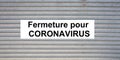 Fermeture pour coronavirus means in french store closed by covid-19 virus Royalty Free Stock Photo