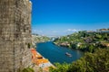 Fernandine Wall of Porto and the Douro River next to the Dom Luis I Bridge in a beautiful sunny day