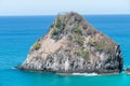 Fernando de Noronha, Brazil. View of single rock of Morro dos Dois Irmaos with crystal clear ocean