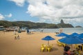 Praia do Porto Beach and Santo Antonio Port with Morro do Pico on backgorund - Fernando de Noronha, Pernambuco, Brazil