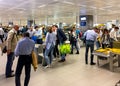 Passengers at security check area in the Milan Malpensa International Airport.