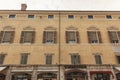 Ancient building with many windows in Ferrara in Italy