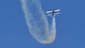 Pitts Special aircraft does a dangerous air display with smoke Royalty Free Stock Photo