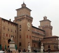 Ferrara, Italy: Visitors near the Estense castle with the Savonarola monument on the left