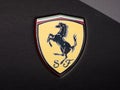 Ferrari badge on black Ferrari luxury car