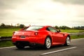 Ferrari 599 GTB Fiorano driving on the highway.