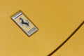 Ferrari logo on yellow sport car