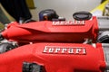 Ferrari`s red sportscar engine close-up. Automobile details. Car repair