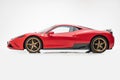 Ferrari 458 Speciale Red with golden wheels, studio, white background, side view