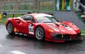 Ferrari supercar 488 racing motorsport in circuit pit lane track wet asphalt