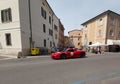 Ferrari Tribute cars pass through Piazza Sordello in Mantua, Italy