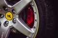 Ferrari wheel and red brake caliber