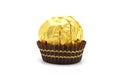 Ferrero Rocher is premium chocolate ball sweets filling with nuts and luxury delicious. Italian chocolate candies isolated on whit