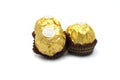 Ferrero Rocher is premium chocolate ball sweets filling with nuts and luxury delicious. Italian chocolate candies isolated on whit