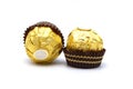 Ferrero Rocher is premium chocolate ball sweets filling with nuts and luxury delicious. Italian chocolate candies isolated on whit